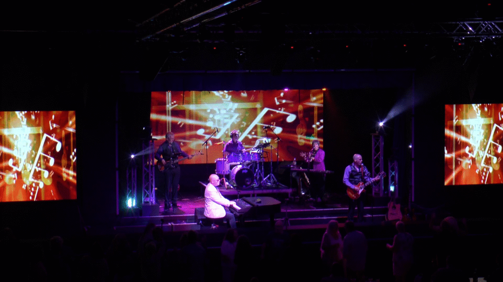Forever Billy Joel performing Uptown Girl live on stage at Tenby